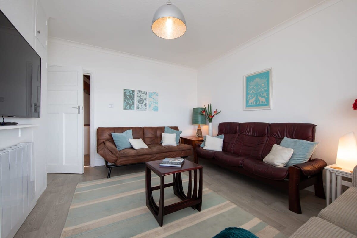 Room for everyone to gather together with three sofas