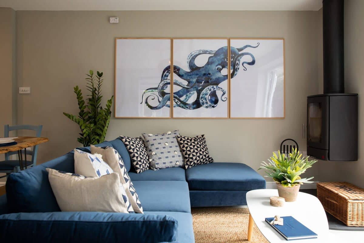 Our lovely lounge features a log burner and l shaped sofa