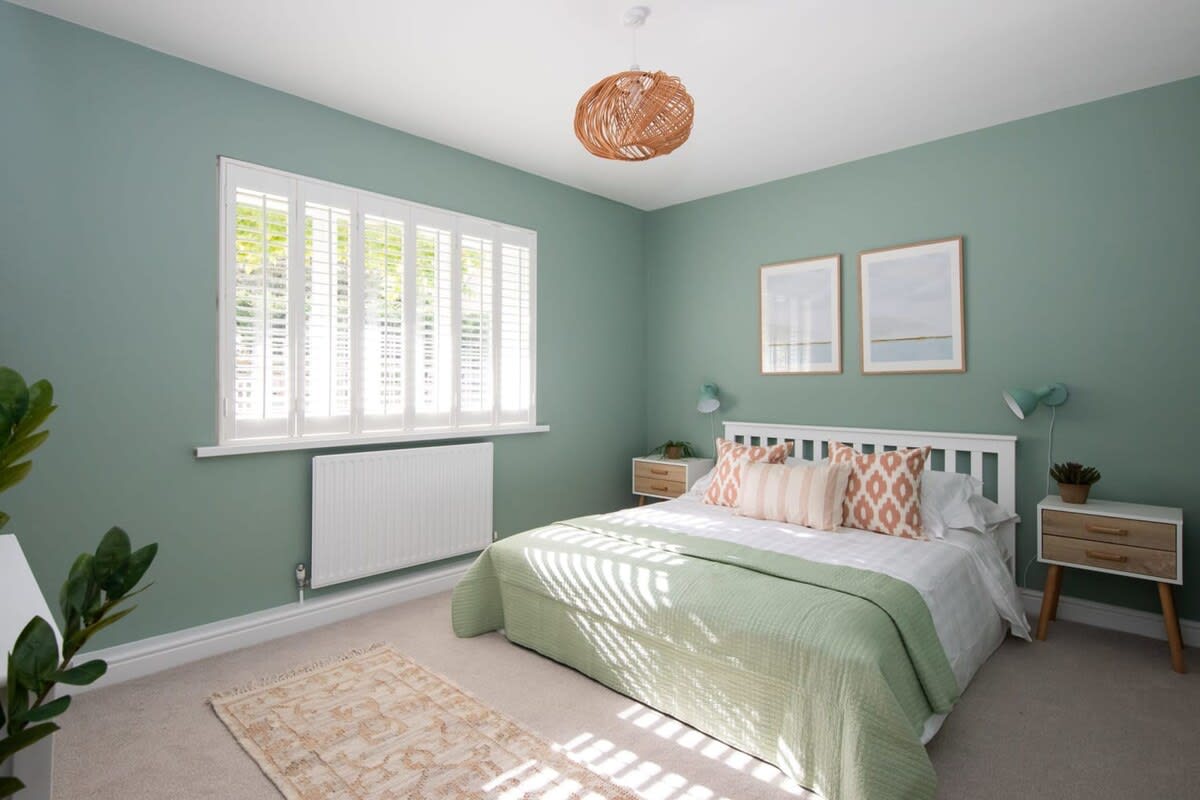 A stylish king-size bedroom with fresh bedding