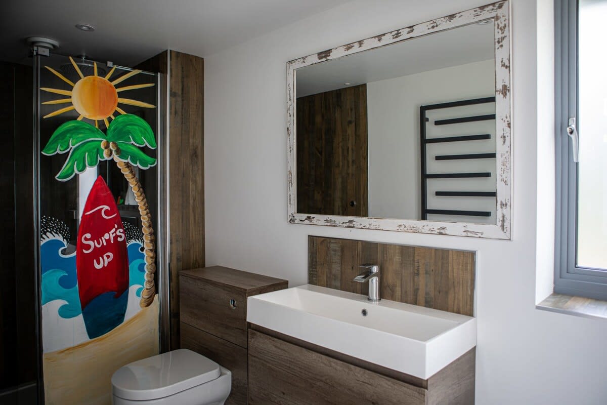 Hop in one of the showers in the fun twin shower room