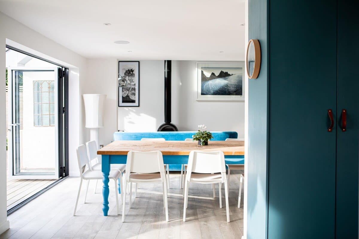 Once the food is ready, serve it at the large dining table, a focal point of the open floor plan living area