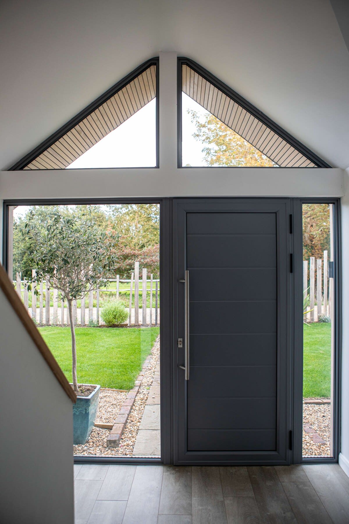Large glass surfaces allow for plenty of natural light to shine upon both floors of this luxurious home