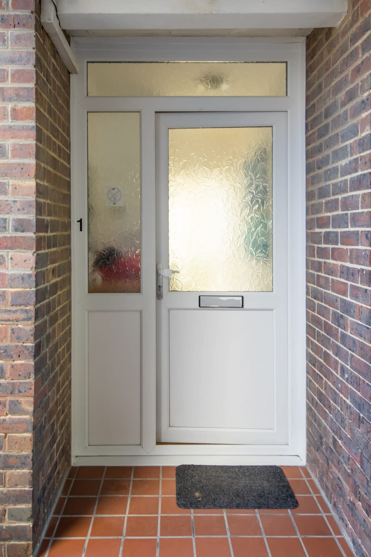 The apartment has a private entrance at the rear of the property.