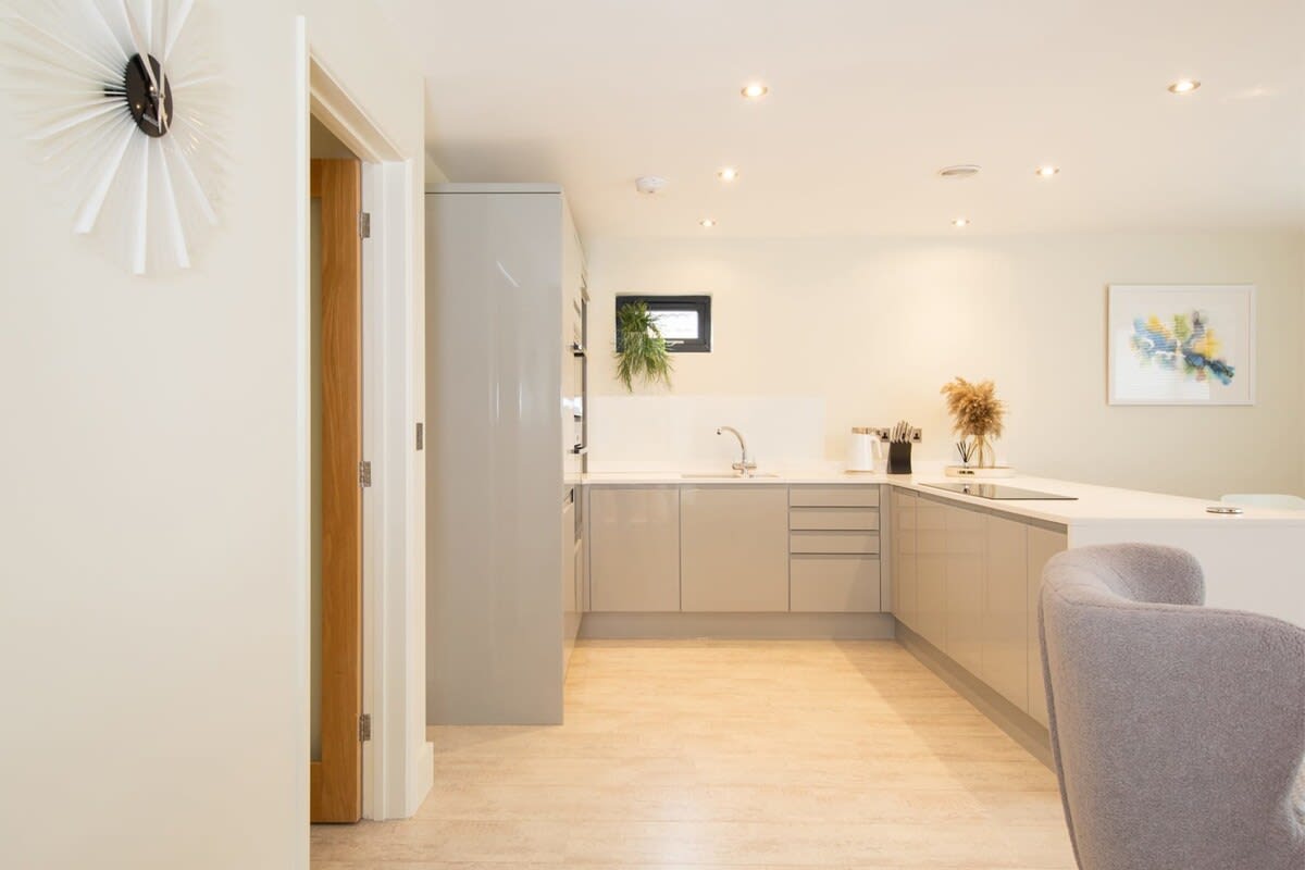 A palette of neutral colors enriches the contemporary and comfortable open design living room