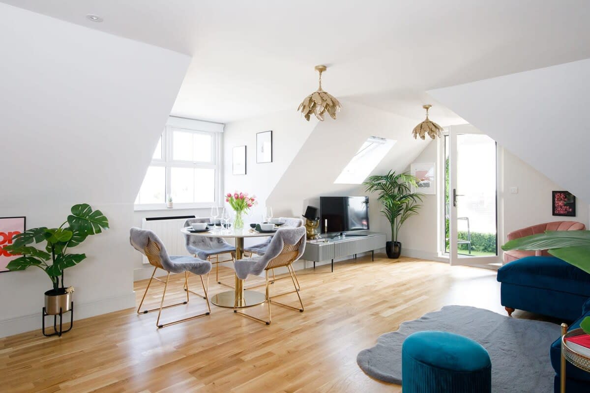 The living area conveniently combines the living room with the kitchen and dining area.