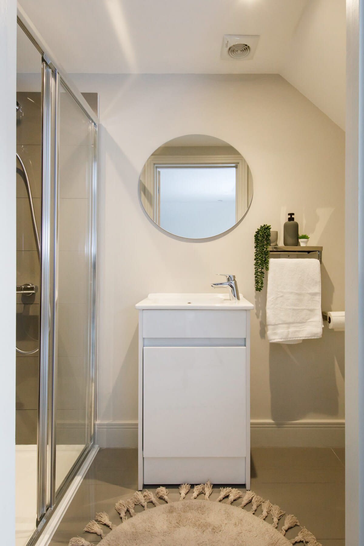 Contemporary ensuite shower room off the master bedroom.