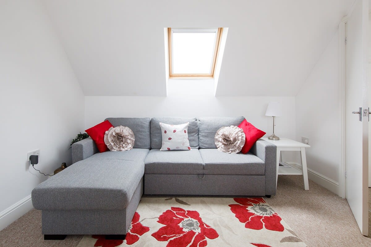 Relax and unwind on the sofa with a drink after a day exploring.