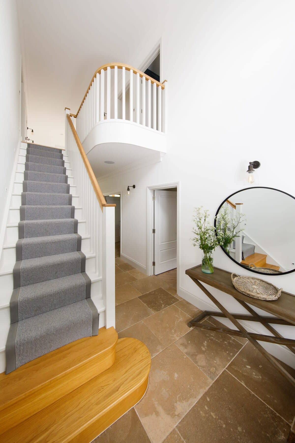 When you enter through the front door you are greeted with the beautiful staircase and classic stone floors