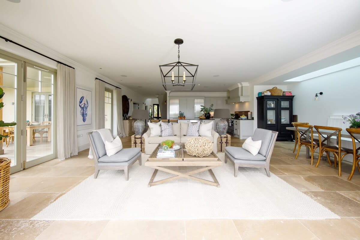 The open concept design living area is the focal point of the ground floor as it combines the fully equipped kitchen and the dining area with the lovely sitting room