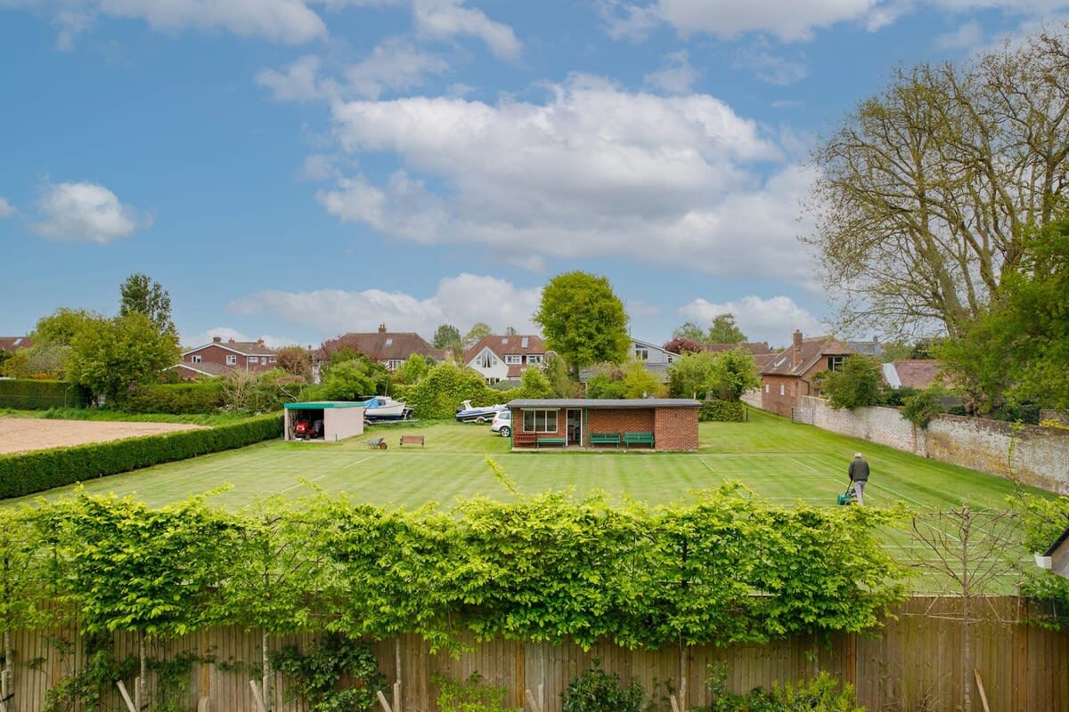 The view from this bedroom over Bosham Bowling Green is sublime