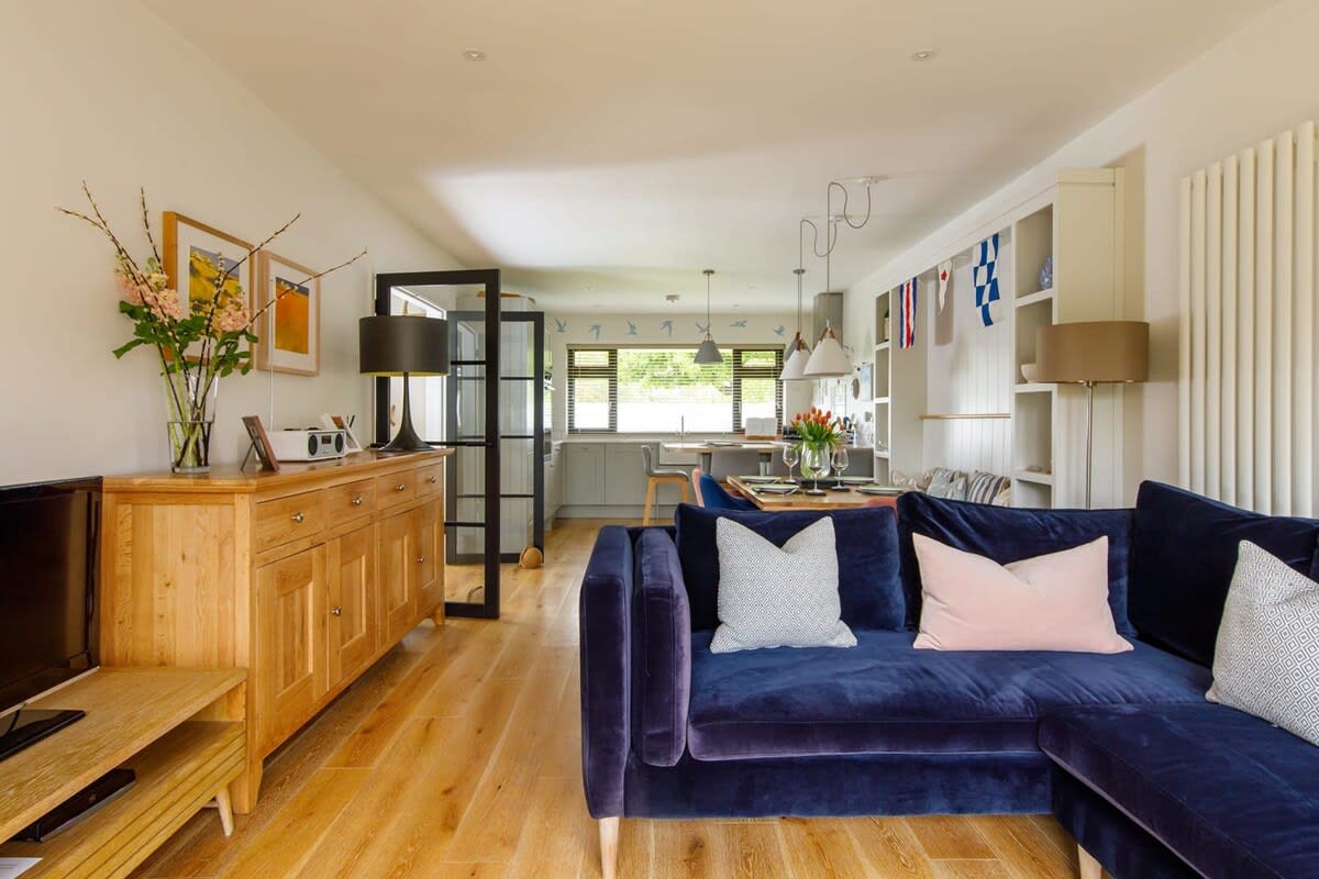 The kitchen and dining space flows into the living area.