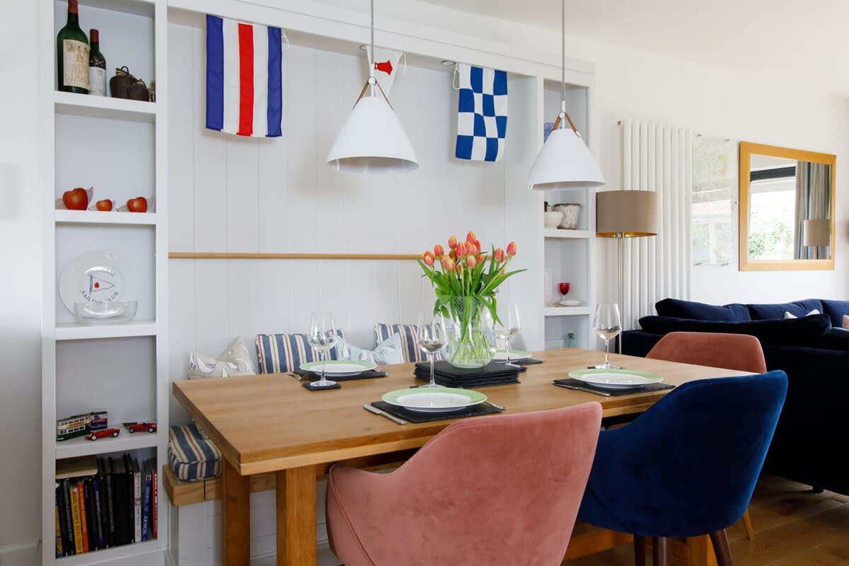 The dining table comfortably seats 6 people with a bench seat on one side.