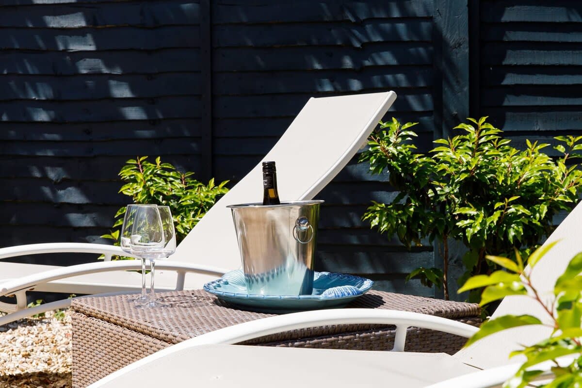 Relax and unwind in the private garden on a sun lounger.