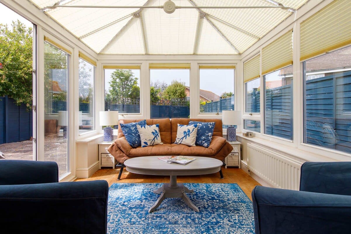 The conservatory is light and airy. The perfect sunny room to enjoy a book or magazine with a cup of tea.