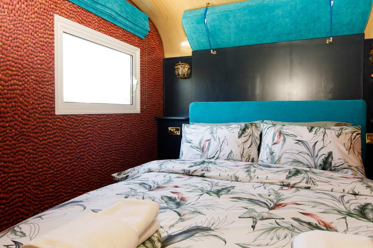 Cosy and comfy, the bed has beautiful linen and decor.