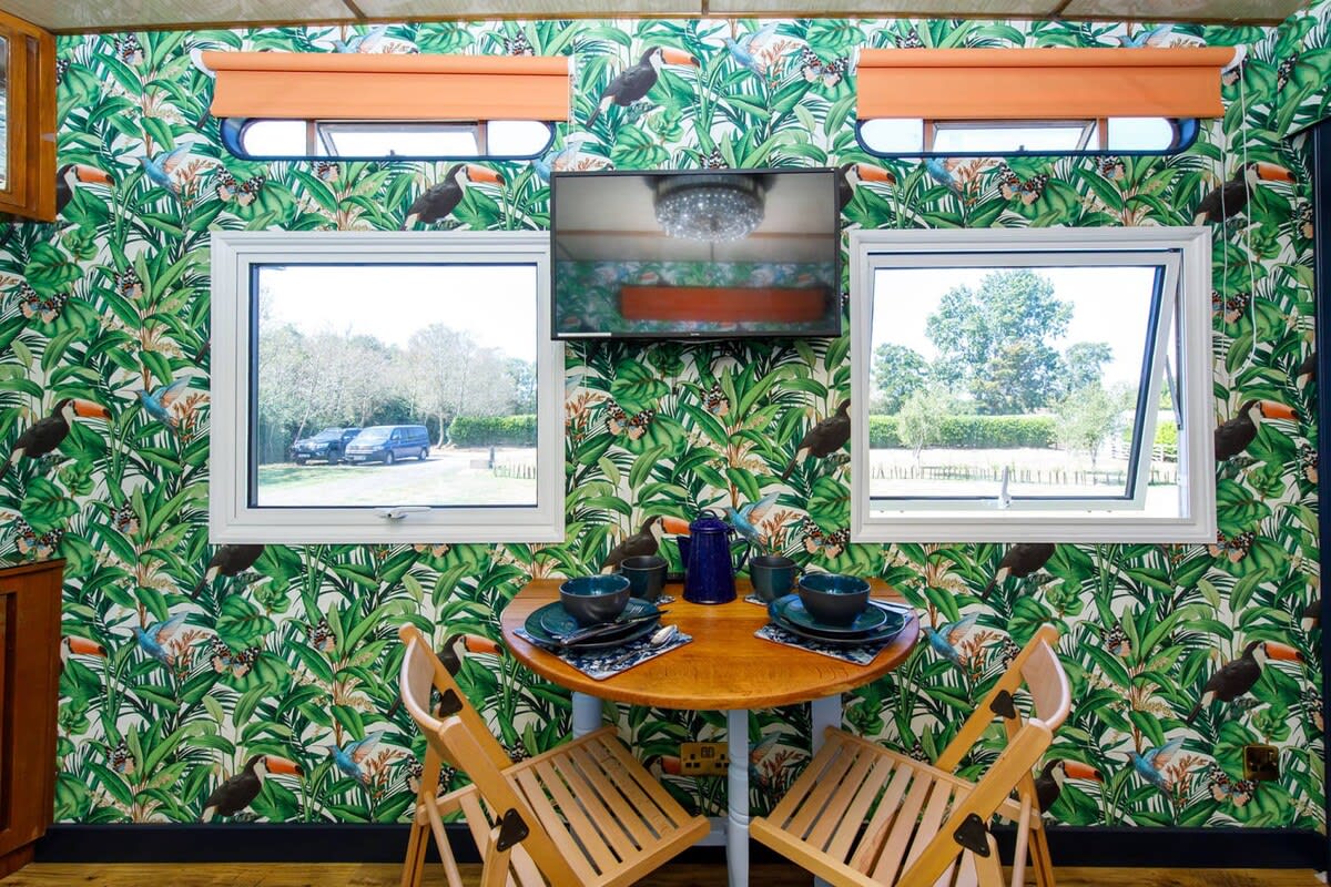 There are plenty of space saving ideas to maximise the living area, such as this Murphy dining table.