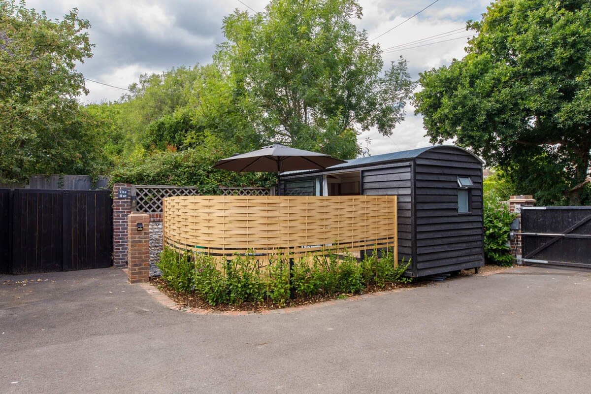 The Hut has it's own private court yard and sits on the grounds of a family home in West Wittering.