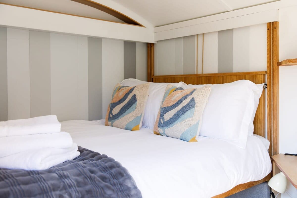 Cosy and romantic. The Hut has a comfy double bed to cuddle up in and get a good night's rest.