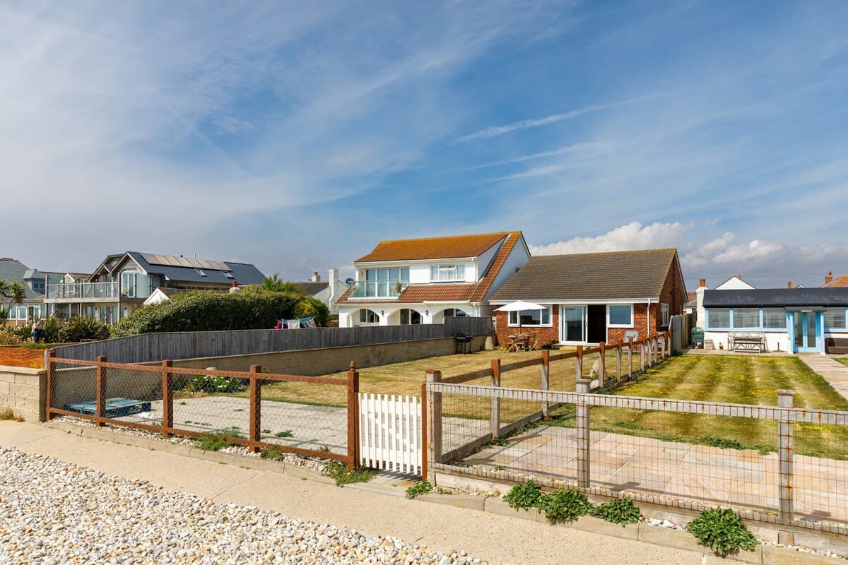 The back garden leads directly onto East Wittering's pebble beach.