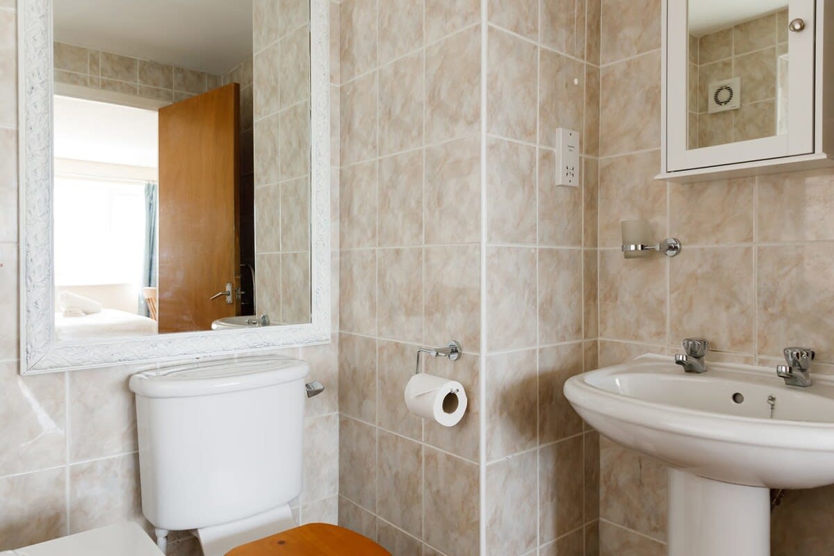 The master bedroom has an ensuite with bath, sink and WC.