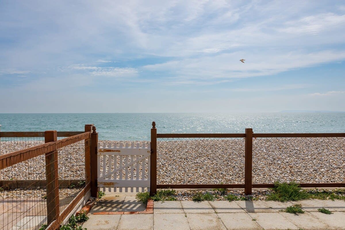 The fully fenced garden leads straight onto the beach.