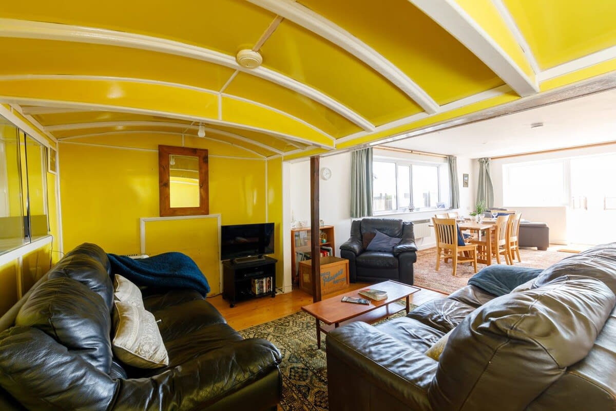 With two large sofas and three comfy armchairs, there are plenty of places to relax.