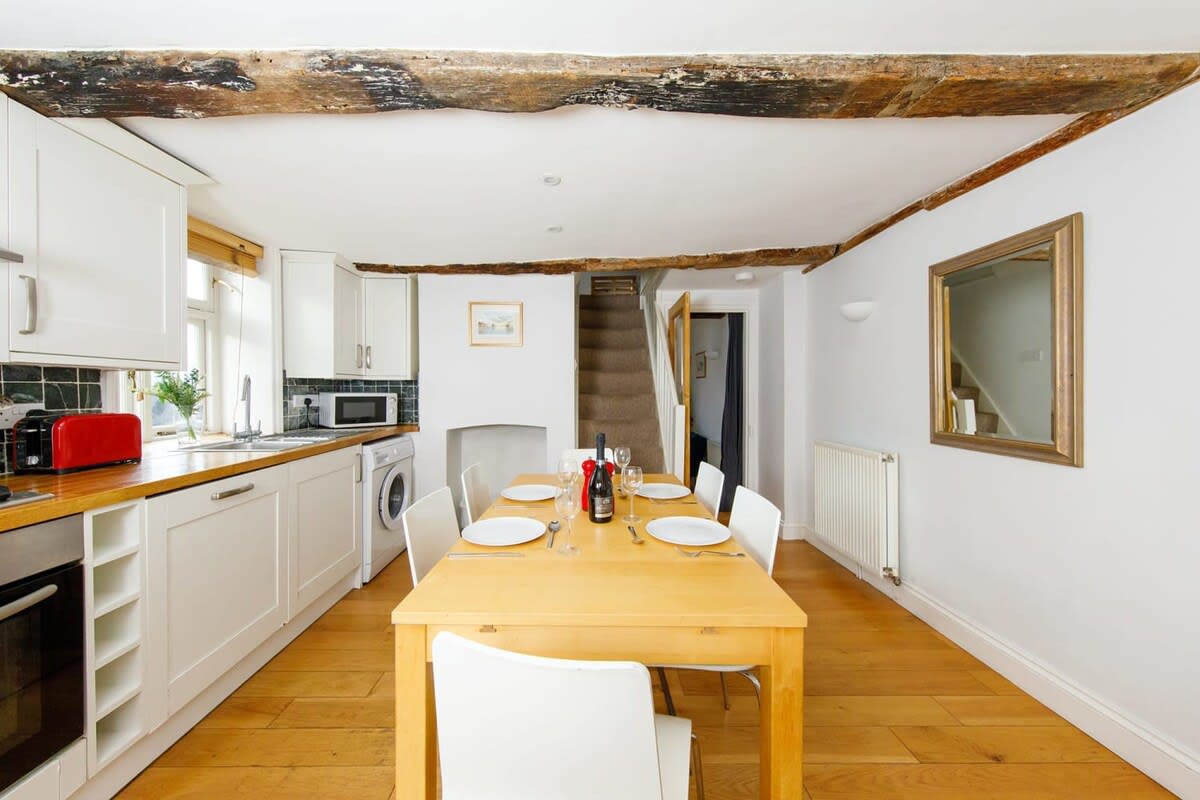 The kitchen's dining table can seat up to 6 guests.