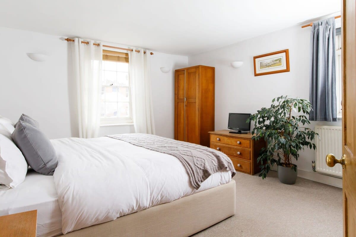 There are four bedrooms over three floors, all designed with comfort in mind (pictured: superking bedroom on first floor).