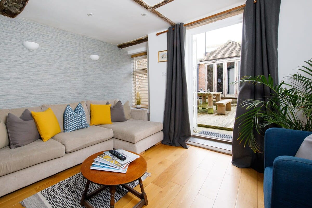 The lounge has a large L-shaped sofa, perfect to kick back on after a day exploring the area.