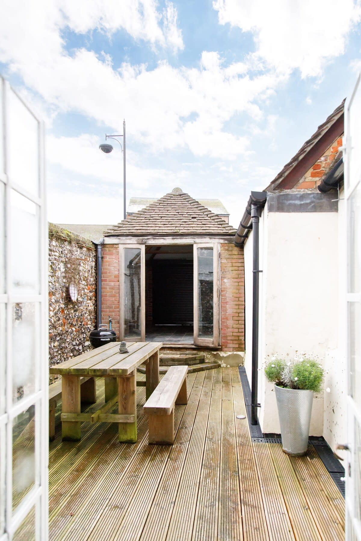 On warmer days, open up the patio doors to your own private courtyard. The perfect spot for a cup of tea or an evening drink.