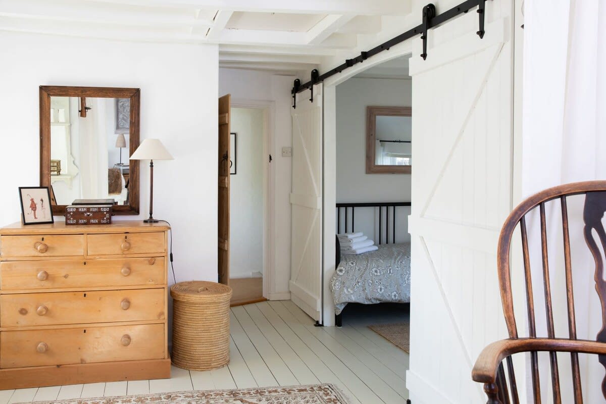 The second room with day bed has sliding doors for privacy.