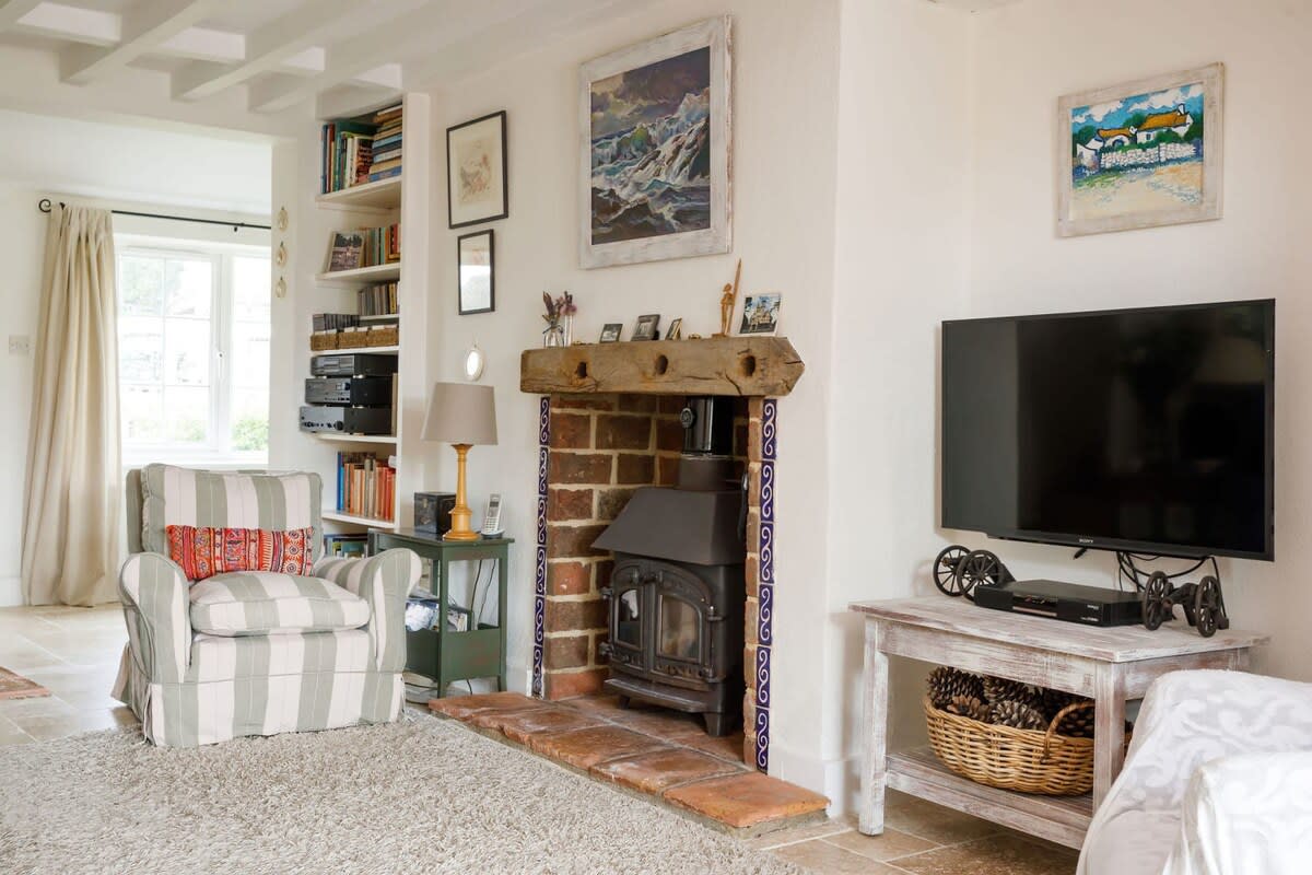 The lounge has a log burner for cosy evenings during the cooler months.