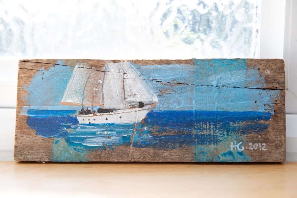 Coastal artwork is dotted around the home.