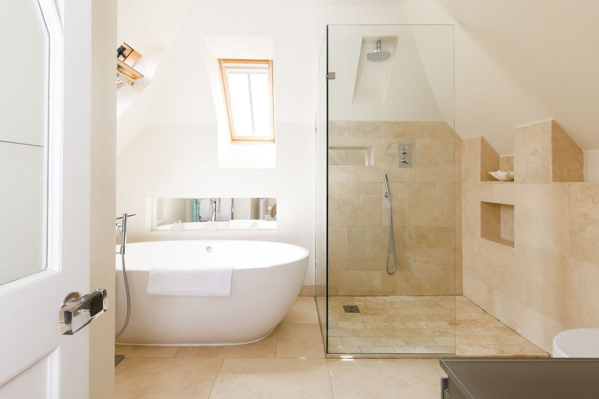 The master bedroom has a luxury ensuite with freestanding bath and large walk-in shower.