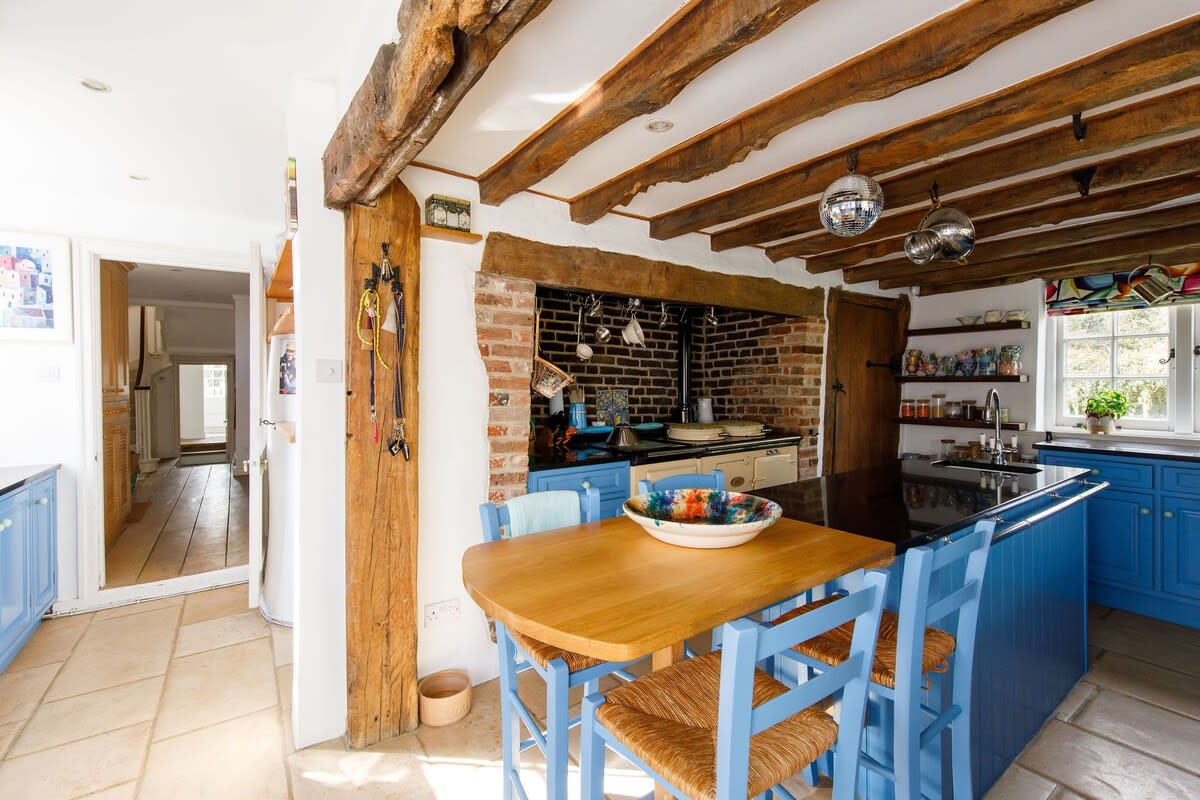 The kitchen is the heart of the home, with a traditional aga and huge central island for preparing food or having a bite to eat.