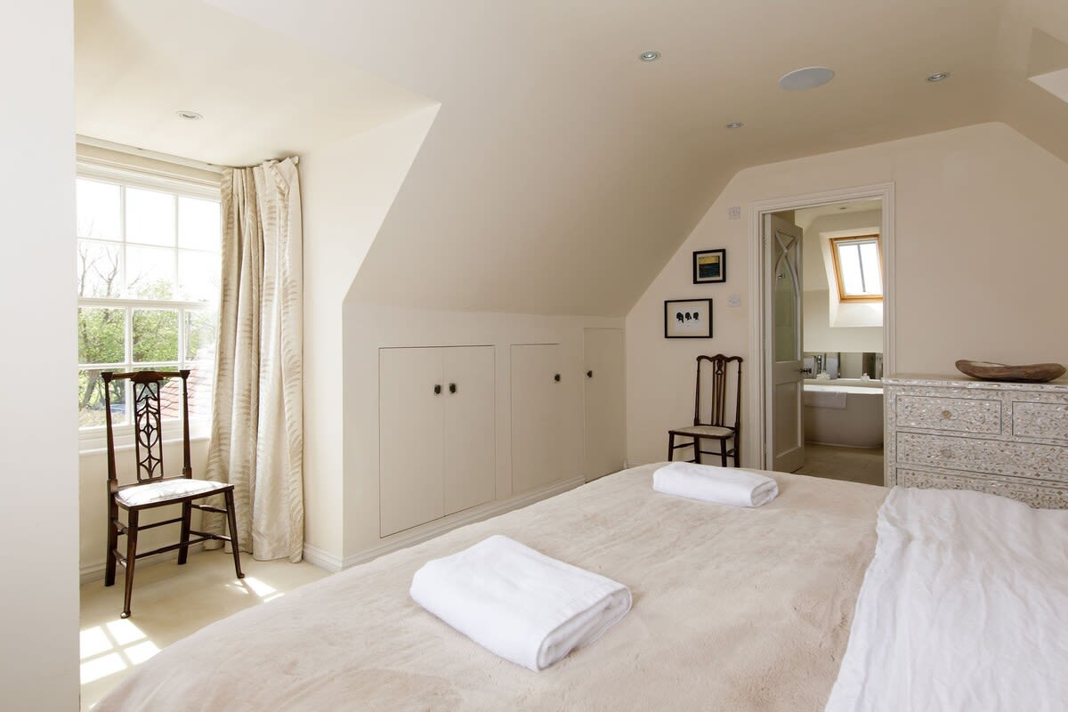 Natural calm decor ensures a restful bedroom to retreat to at the end of the day.