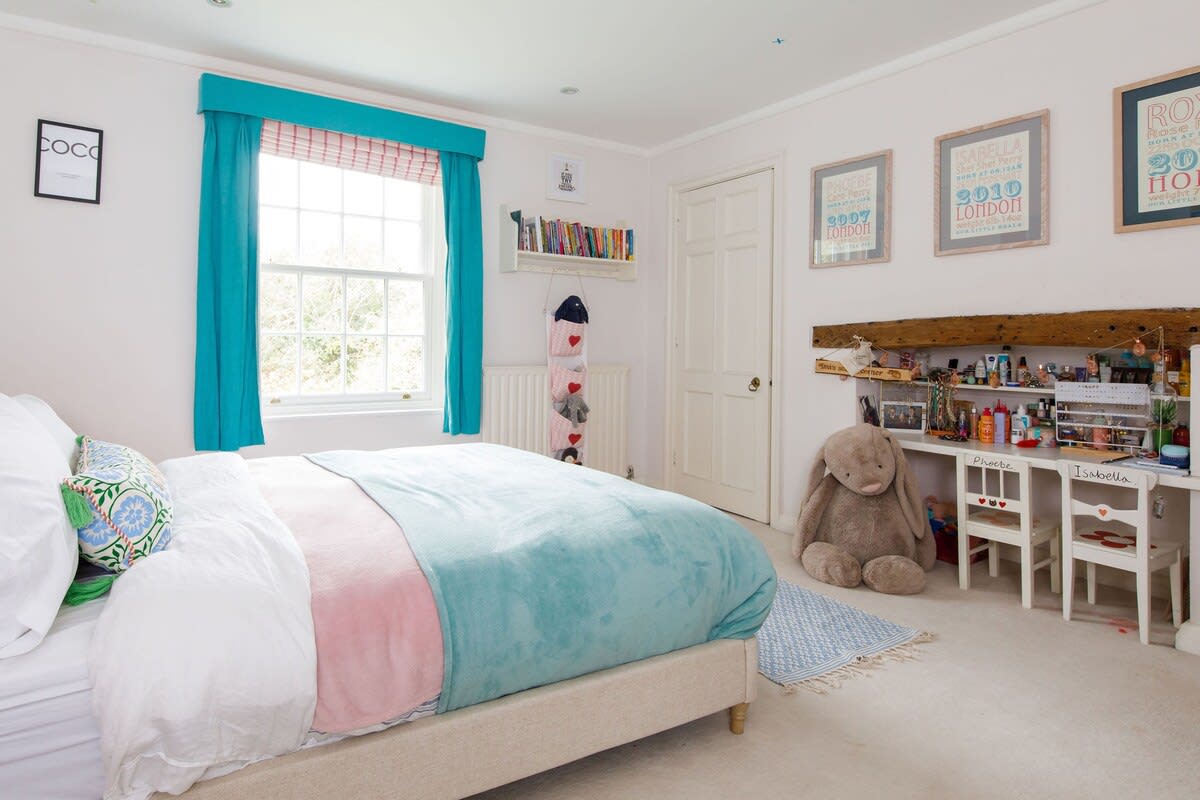 The third bedroom is a comfy and colourful double.