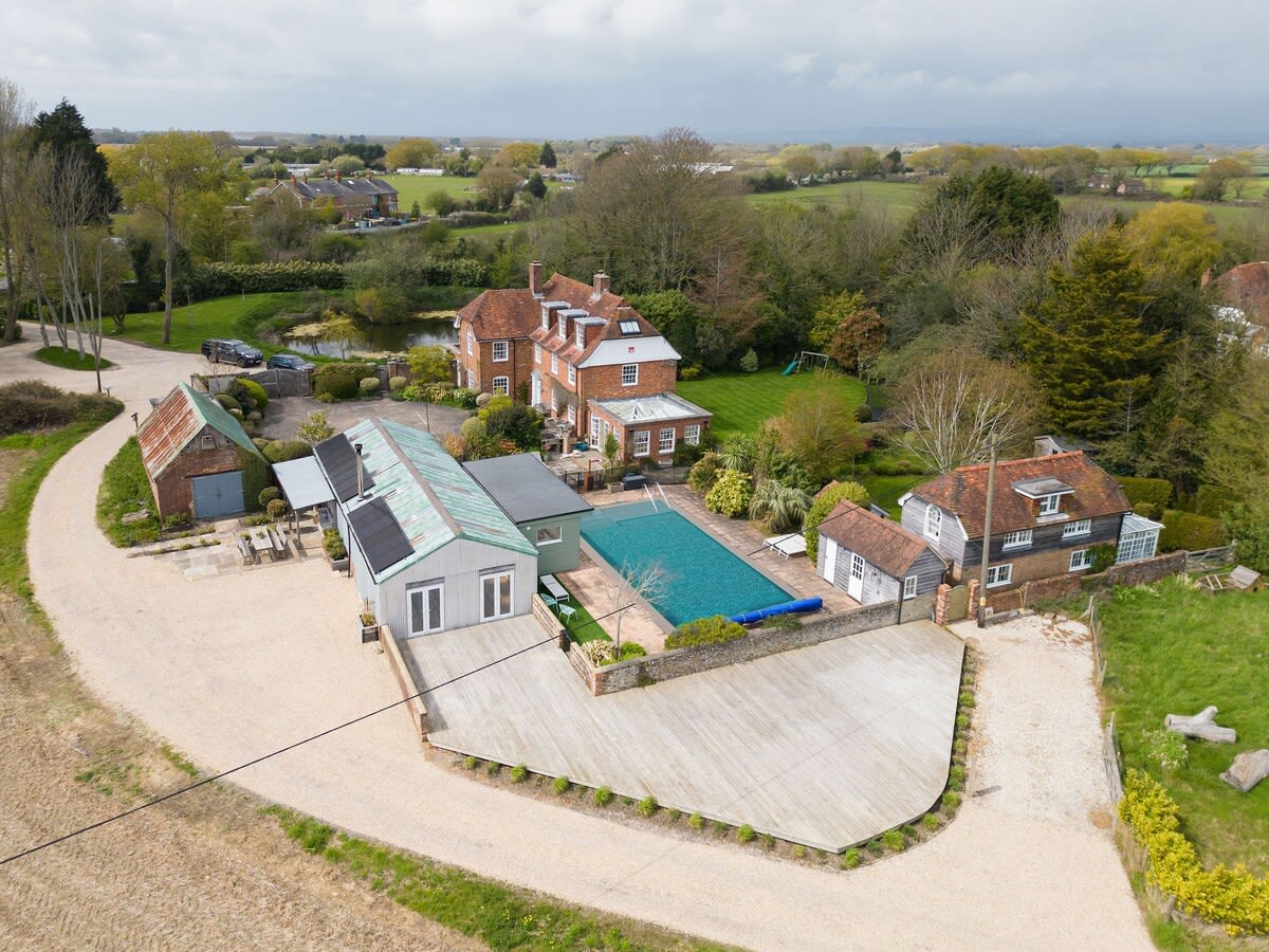 Aerial views from the back of the property. The large decked area is where yoga classes are held on warmer days. The pool and other outside space is private to the home.