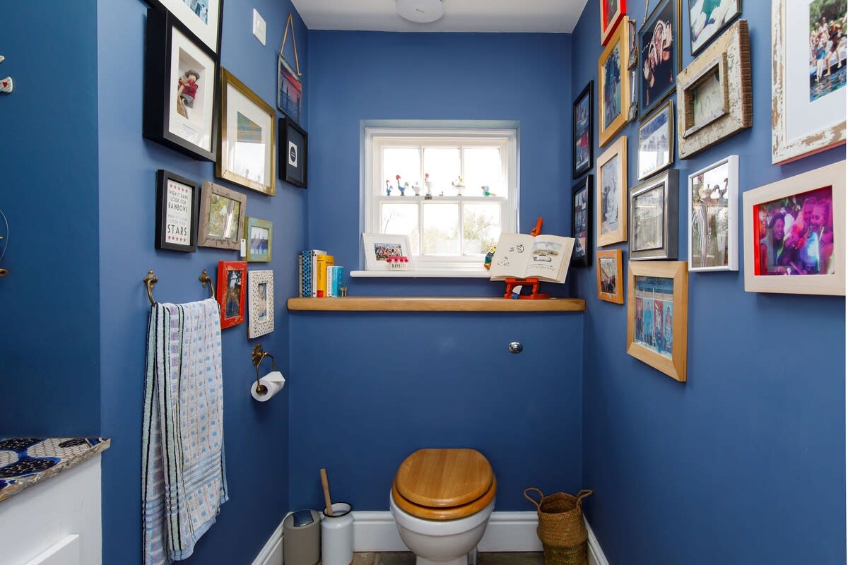 The cloakroom is at the back of the home, next to the utility.