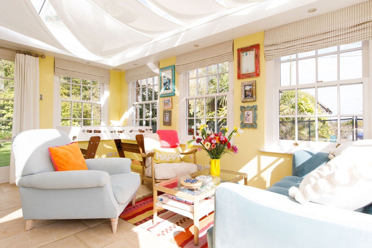 The bright and sunny orangery has a cosy and comfy seating area.