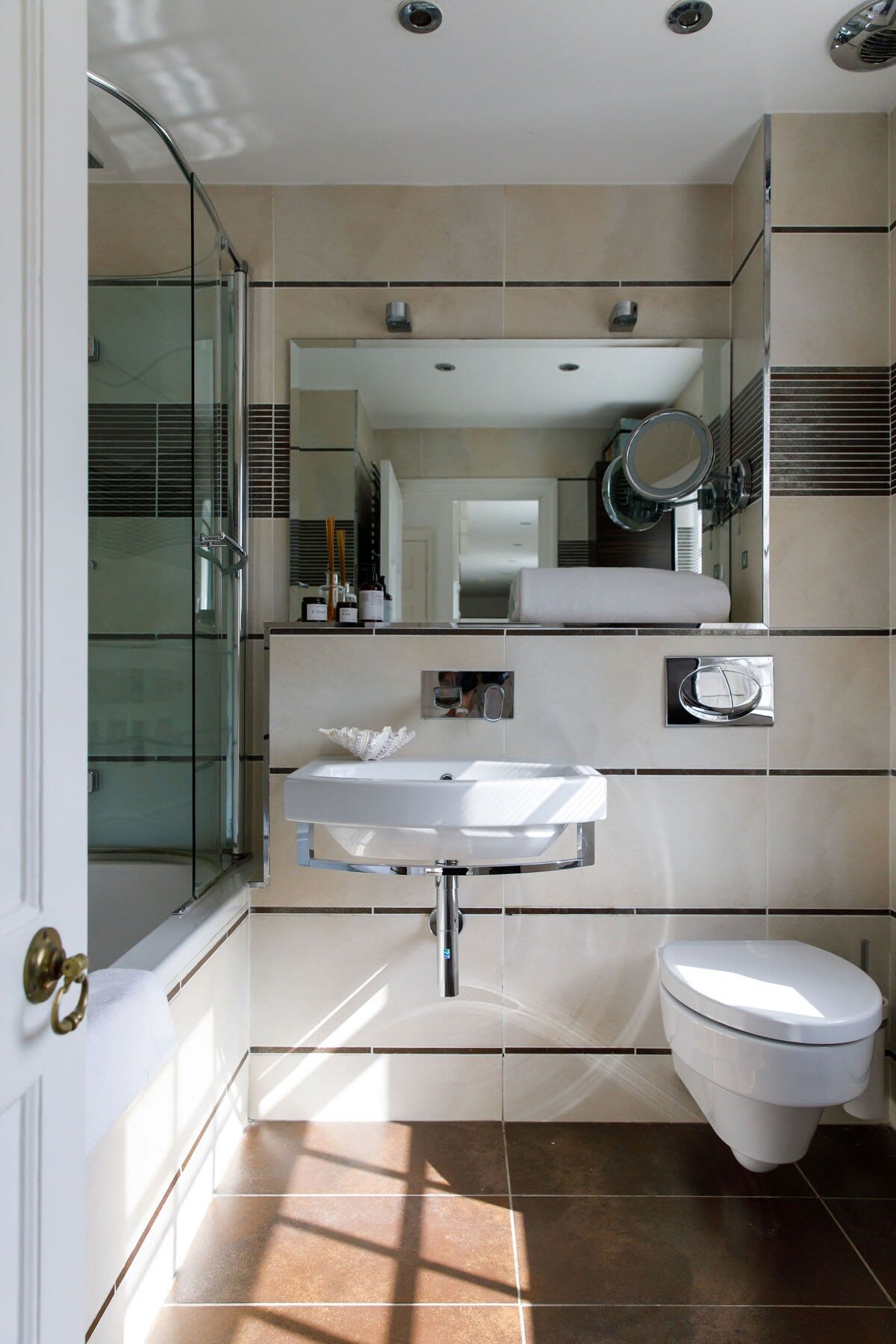 The spacious family bathroom has a bath, WC and sink.