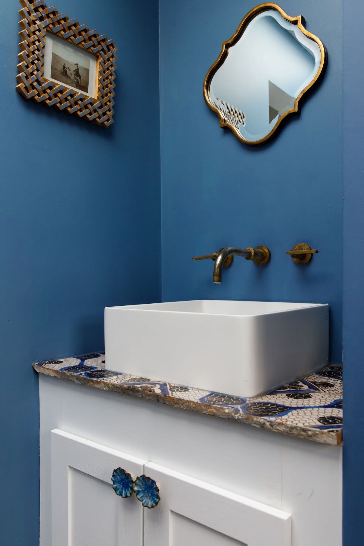 Patterned tiles and pretty cupboard door handles.