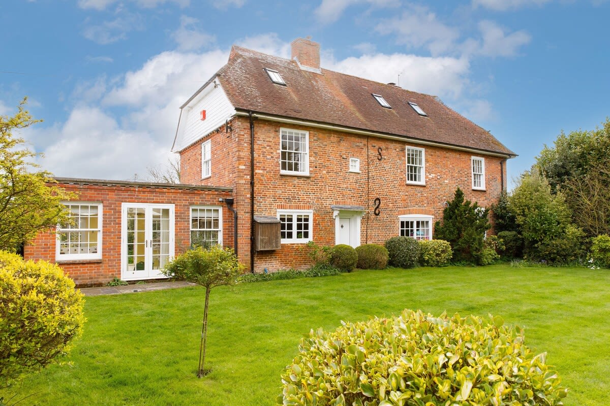 The rear of Hatchers with large lawn, perfect for ball games.