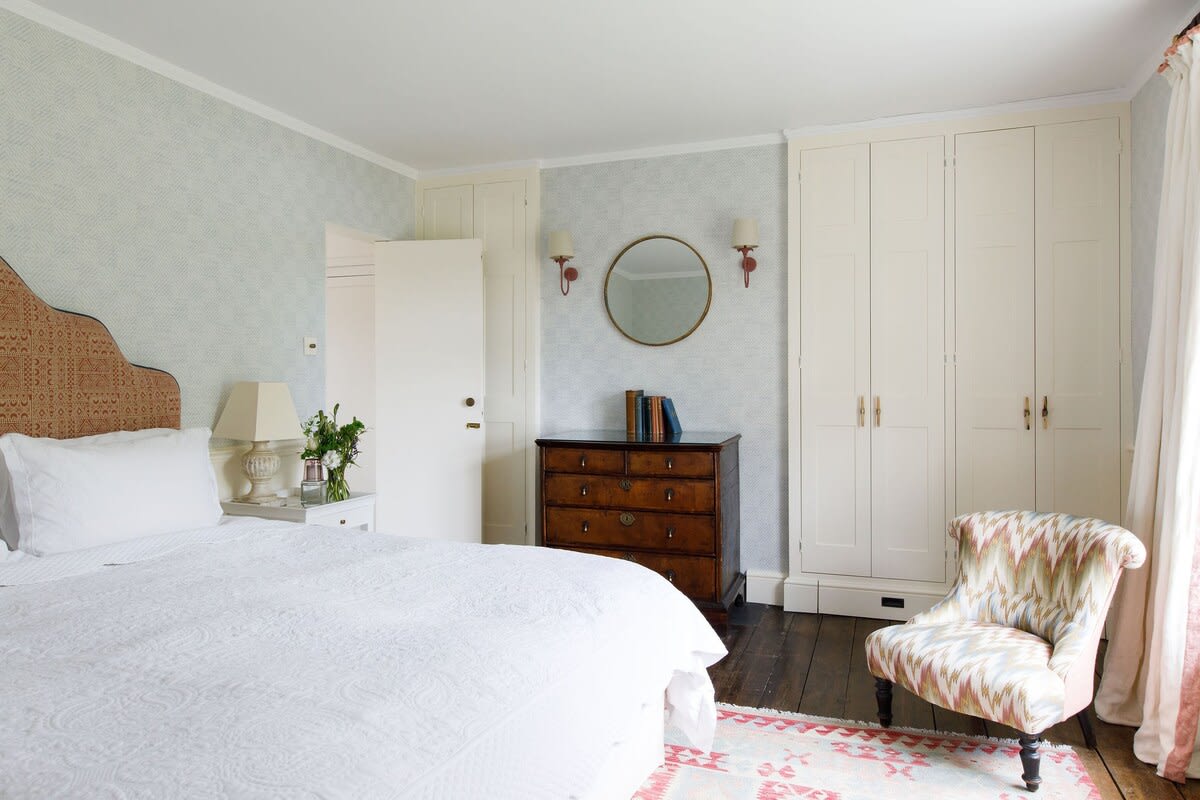 The charming master bedroom, full of English charm and style, has a comfy superking bed, ample wardrobe space and antique furniture.