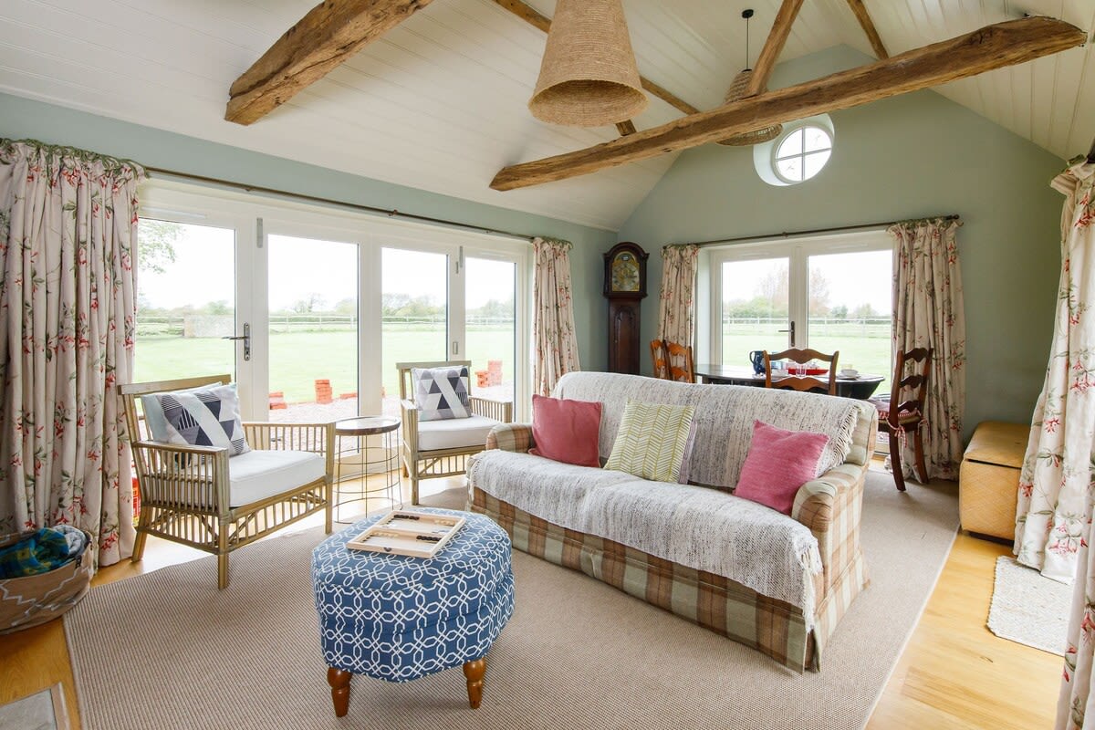 The snug lounge, off the kitchen, is a great spot to watch a film or catch up on a favourite show on the Smart TV