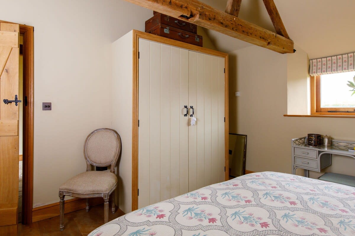 The super king room in the annexe has exposed beams and original features.