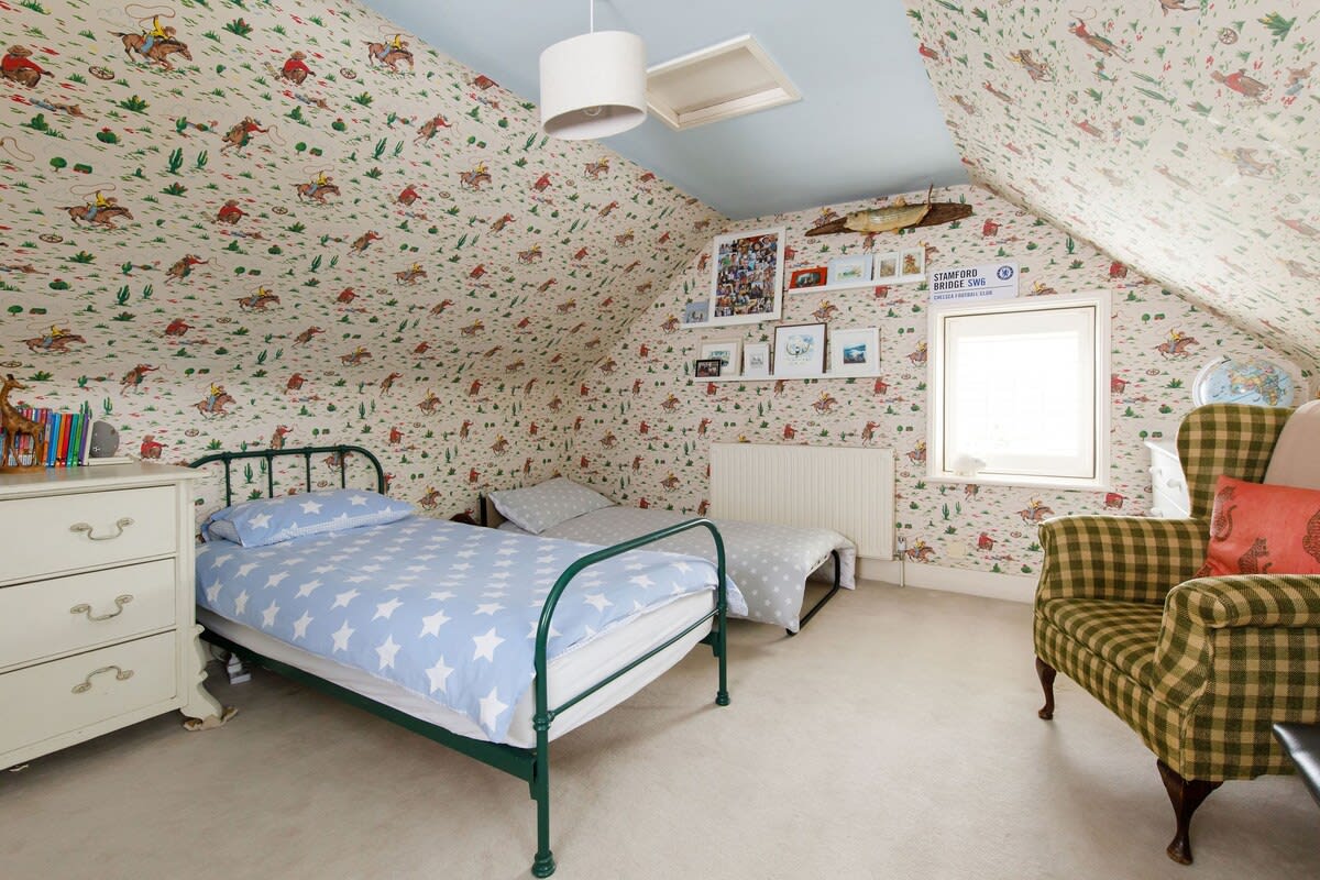 The top floor has two children's room, both with three single beds.