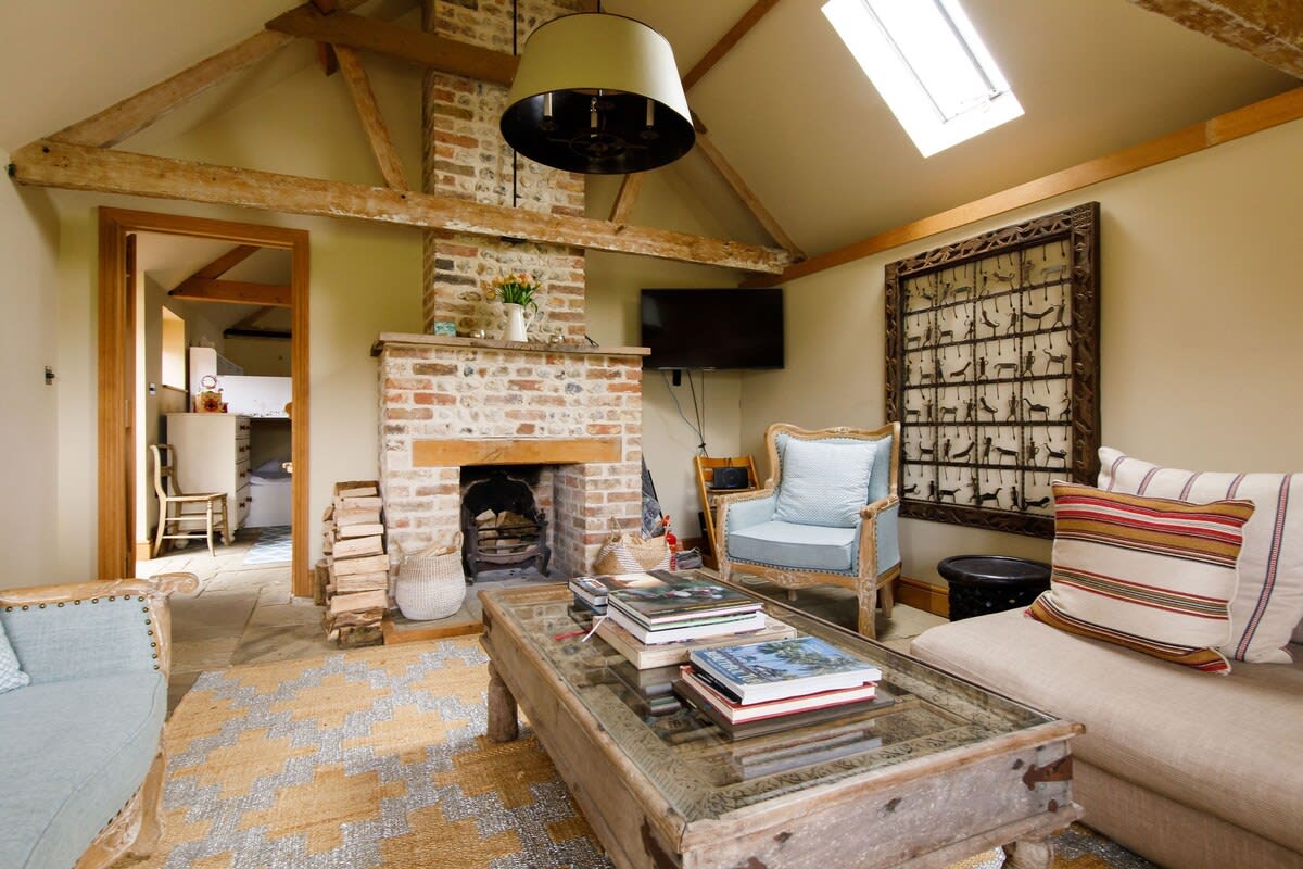 The living area is rich in textures and reclaimed furniture.