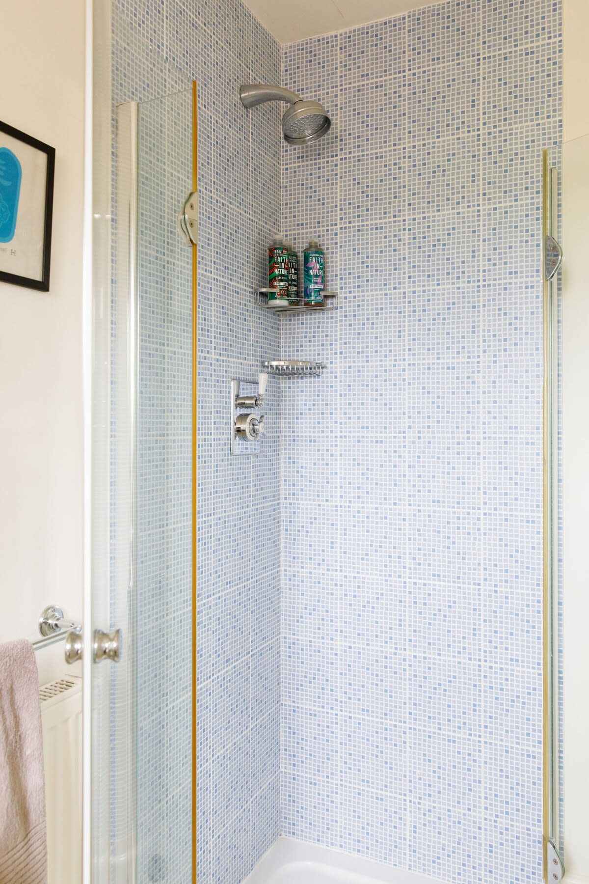 The shower with pretty country tiles.