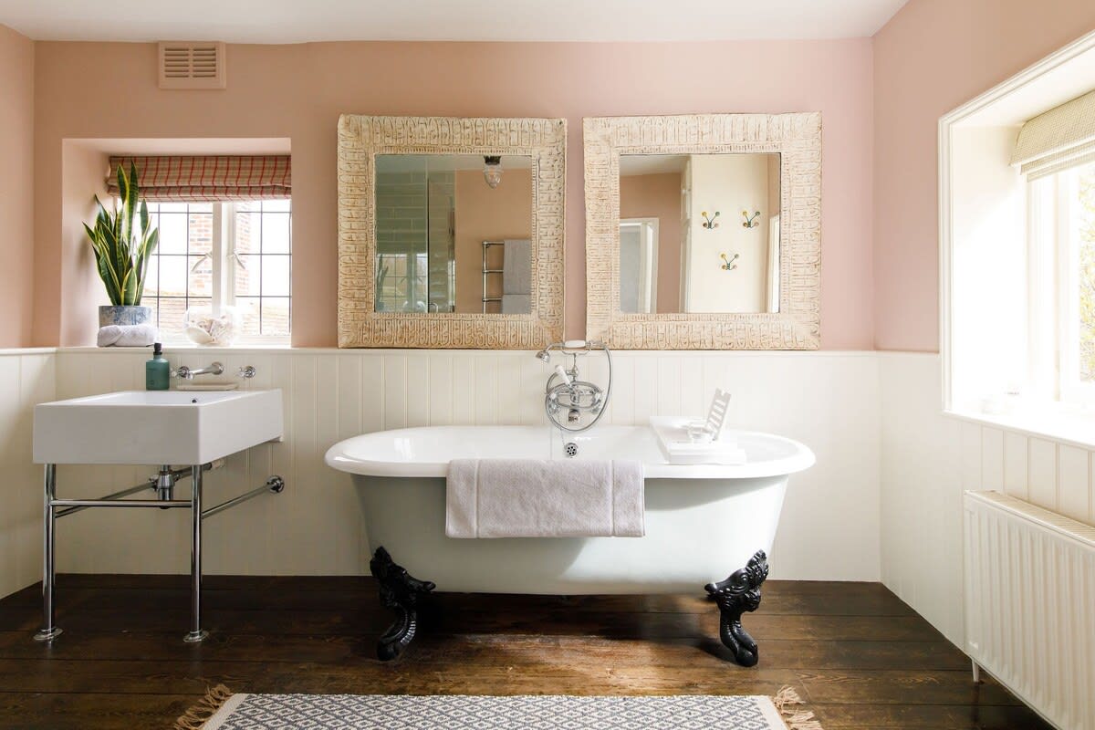 The master bedroom's ensuite has a luxury roll top bath.